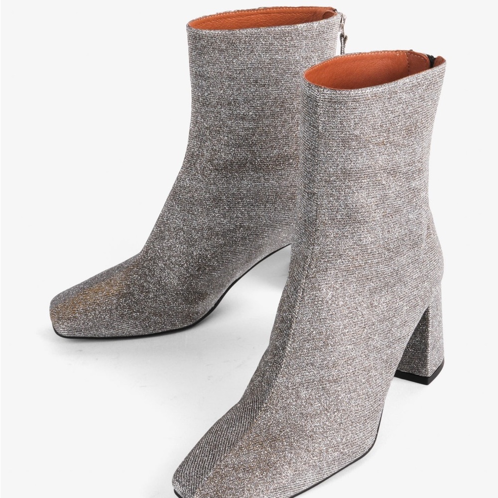 INTENTIONALLY BLANK Silver Heeled Boots Sleek Design